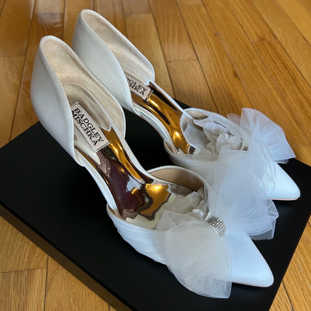 Badgley Mishka satin wedding heels with bow in “Soft White Satin”